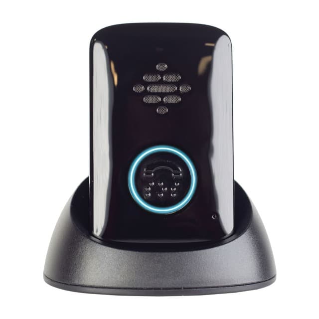 The Belle+ pendant standing in its charging cradle, its call button ringed in blue light.